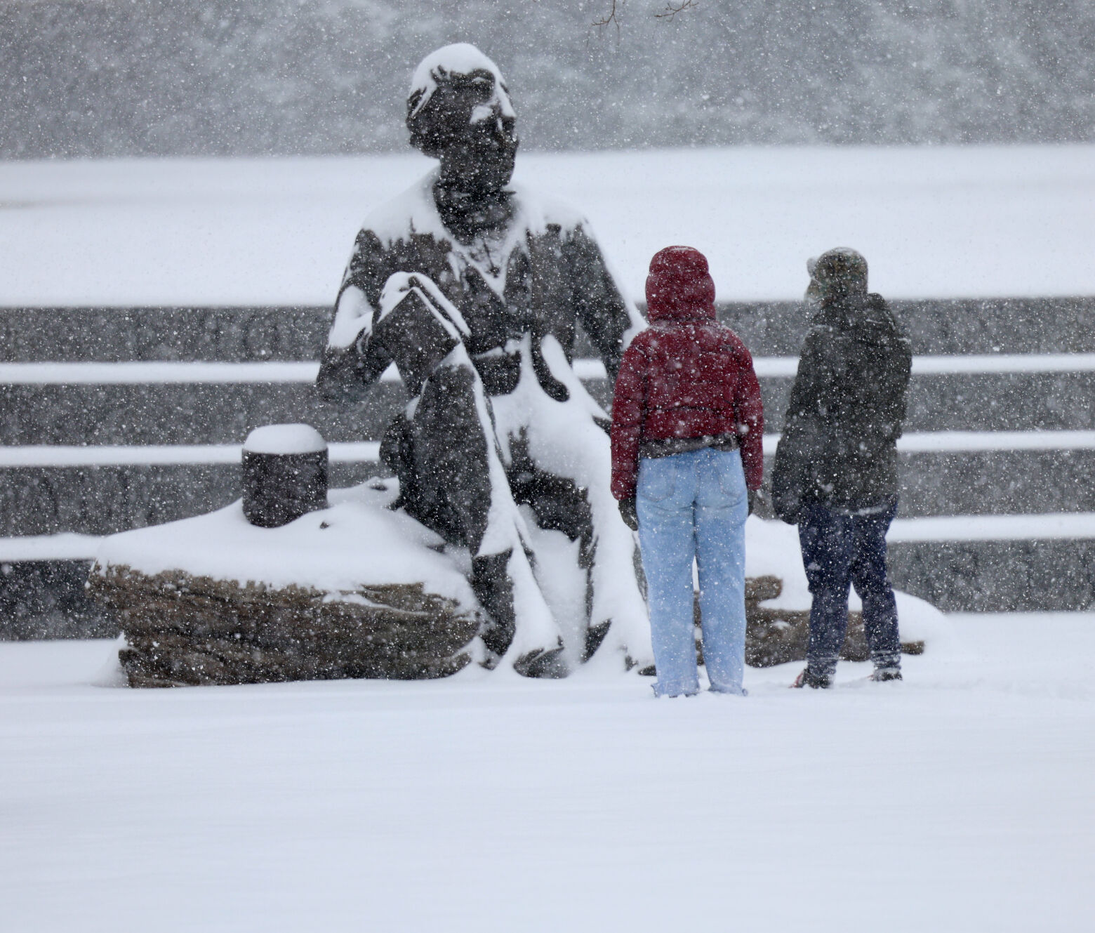 2 people at Lincoln Statue in snow - Jan. 5, 2025.JPG